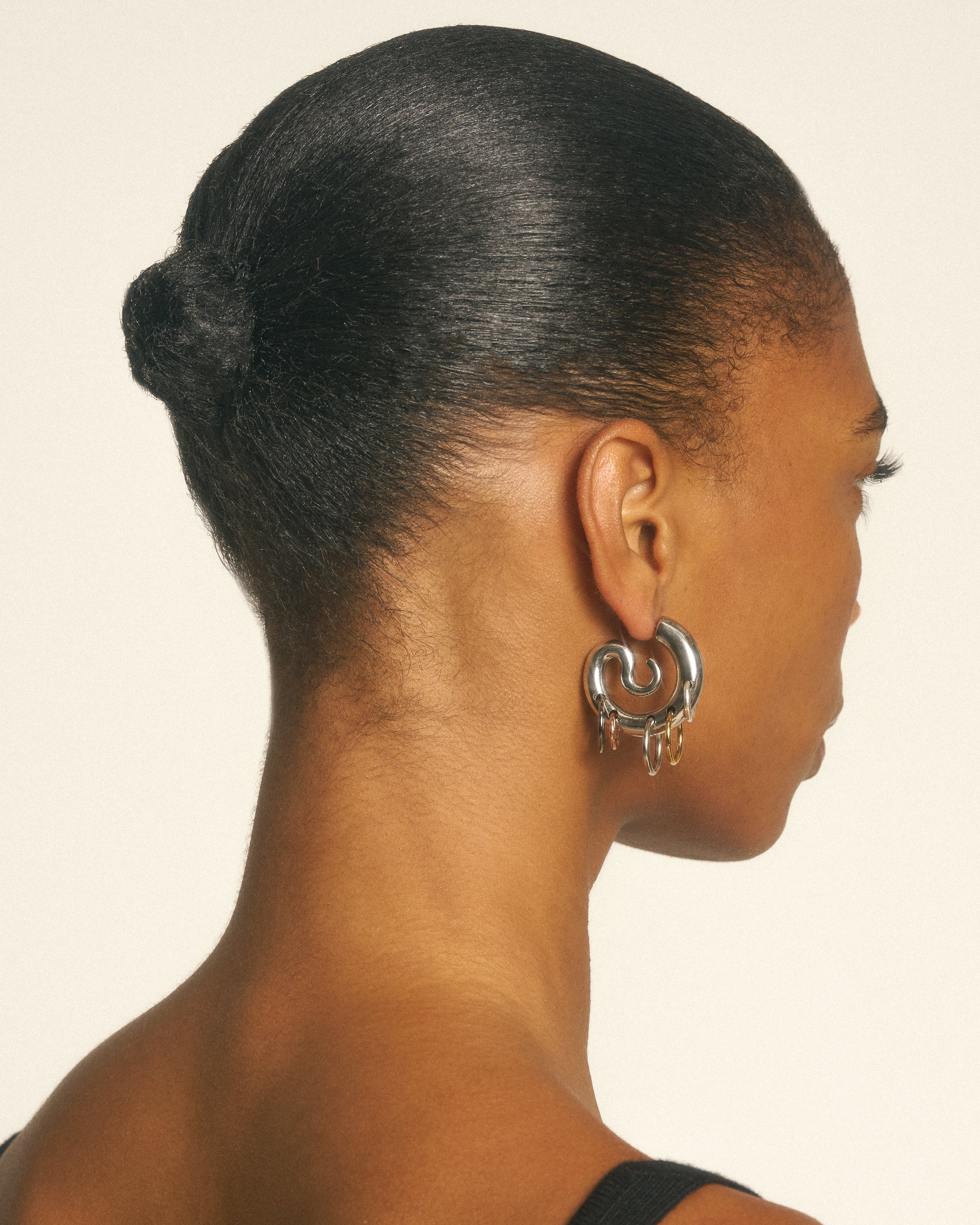 Pierced serpent hoops