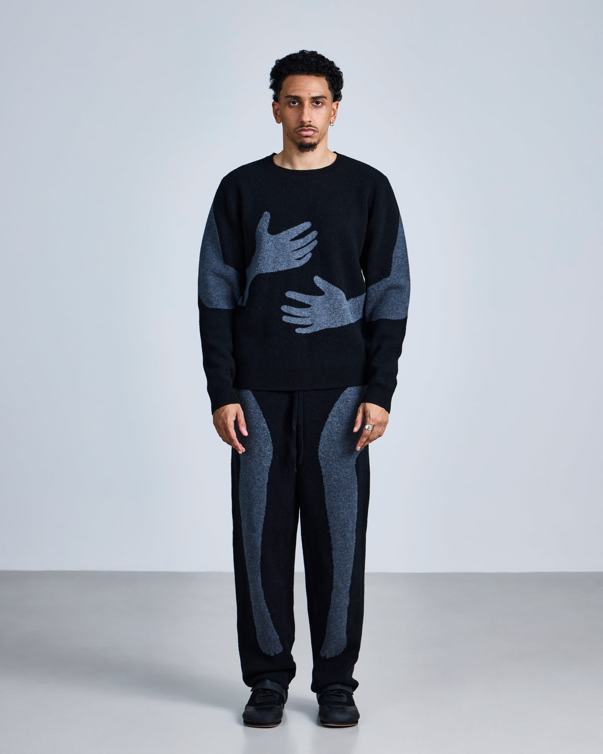 Knitted 'embrace' jumper