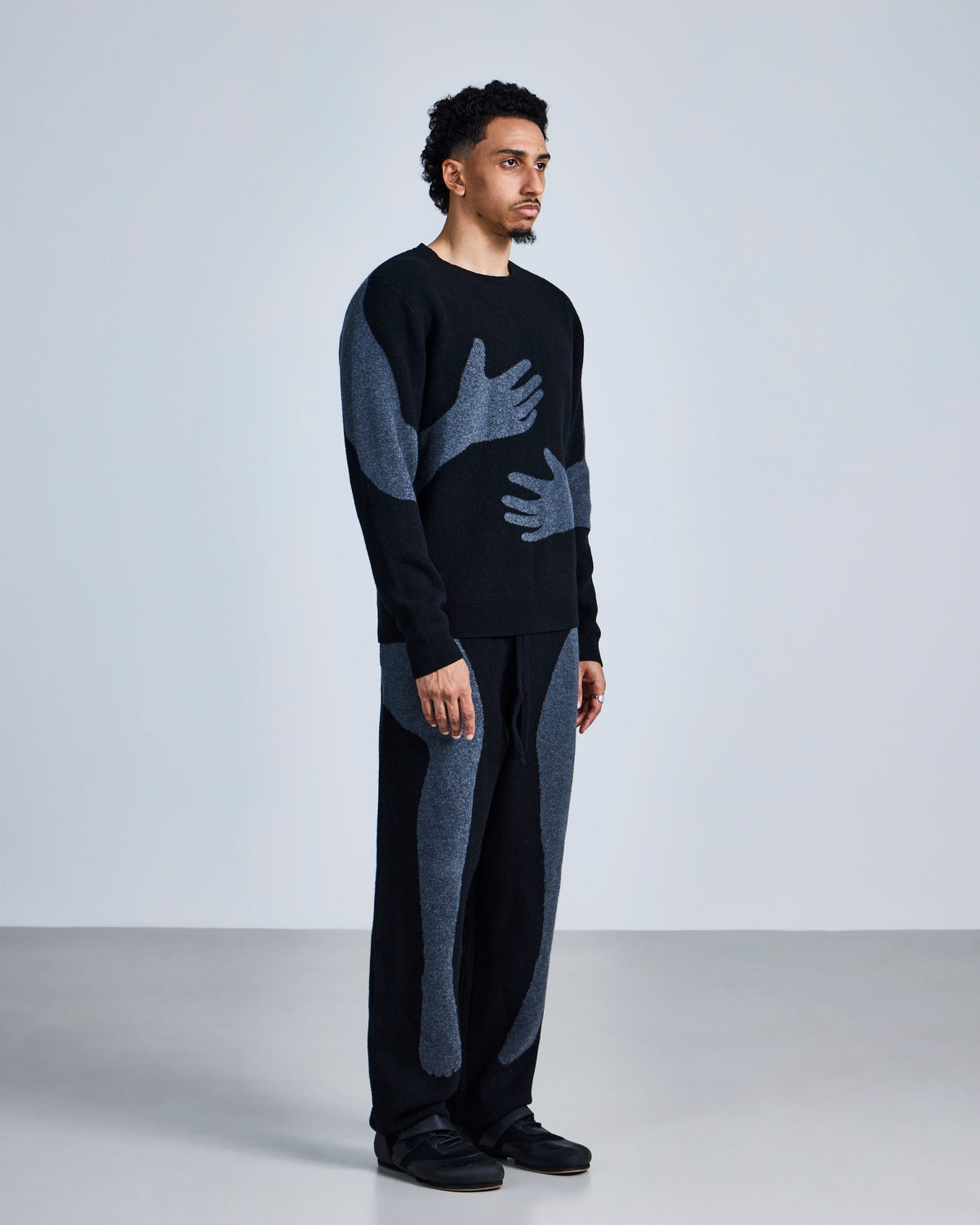Knitted 'embrace' jumper