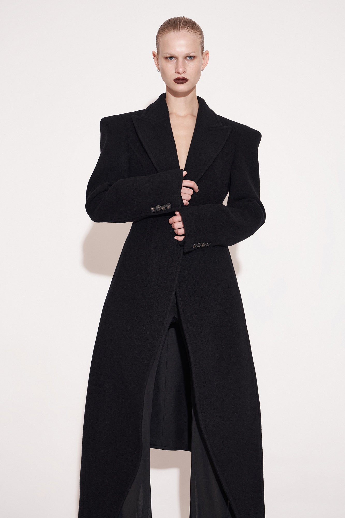 Wool coat with wide shoulders and swallowtail hem