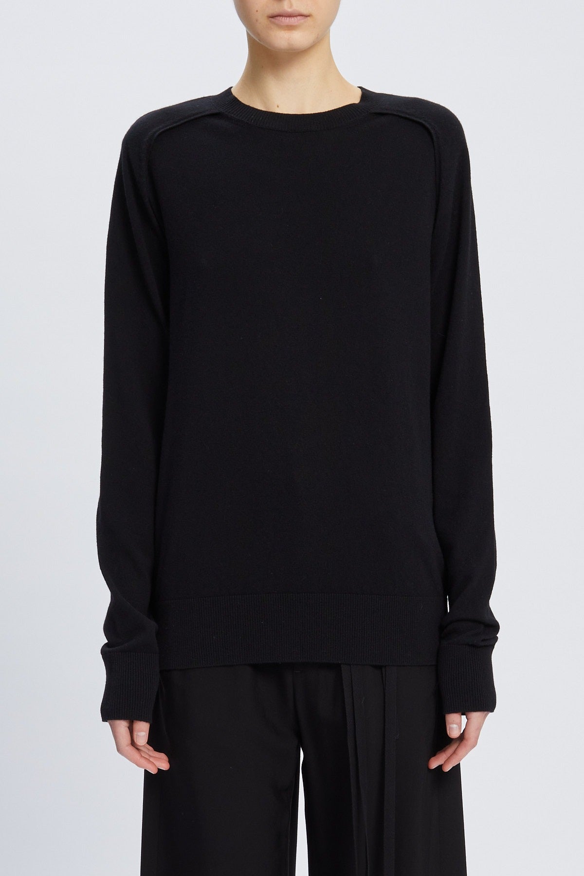 Ulu crew neck sweater with cut out armhole detail