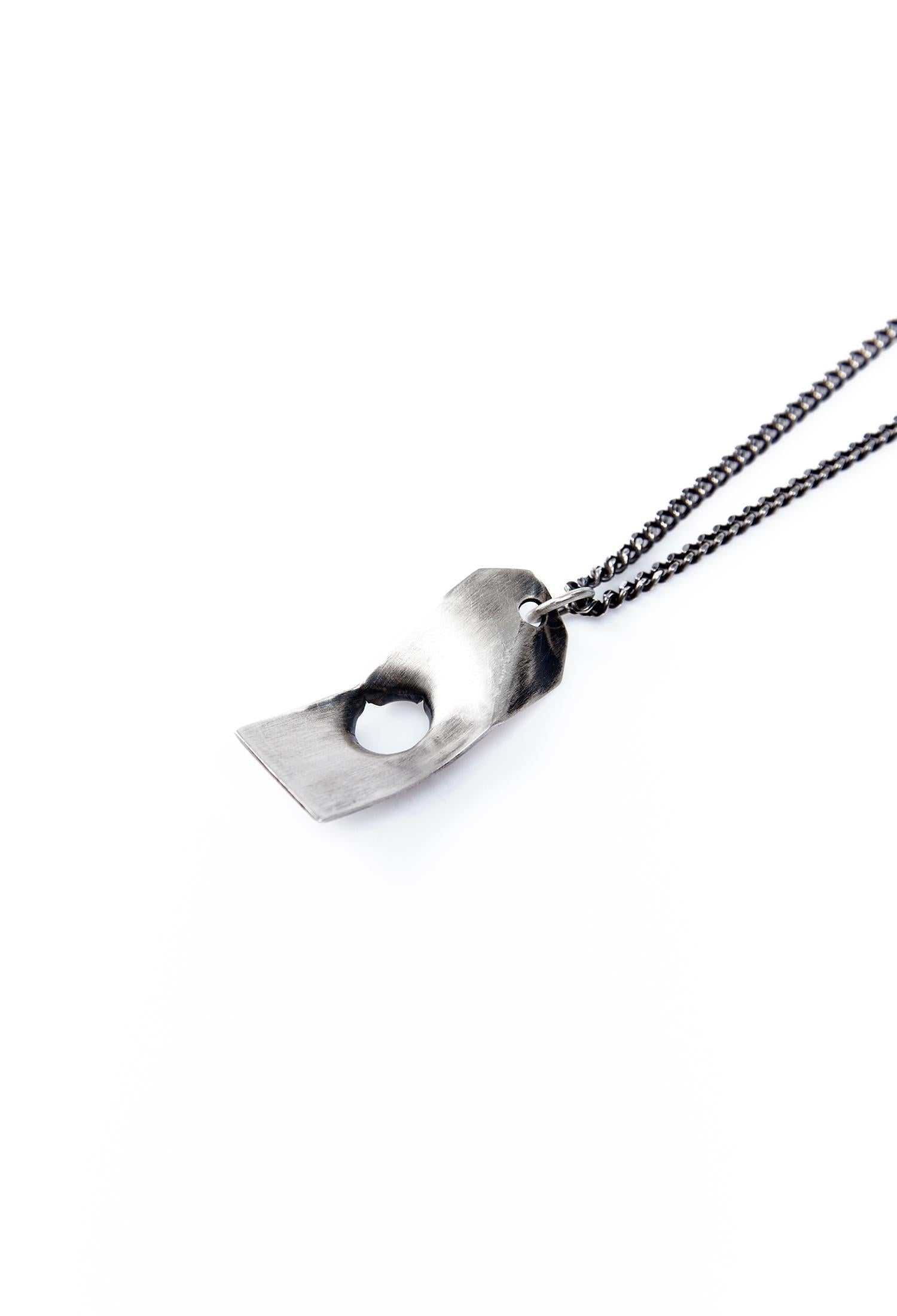 Bullet hole pendant