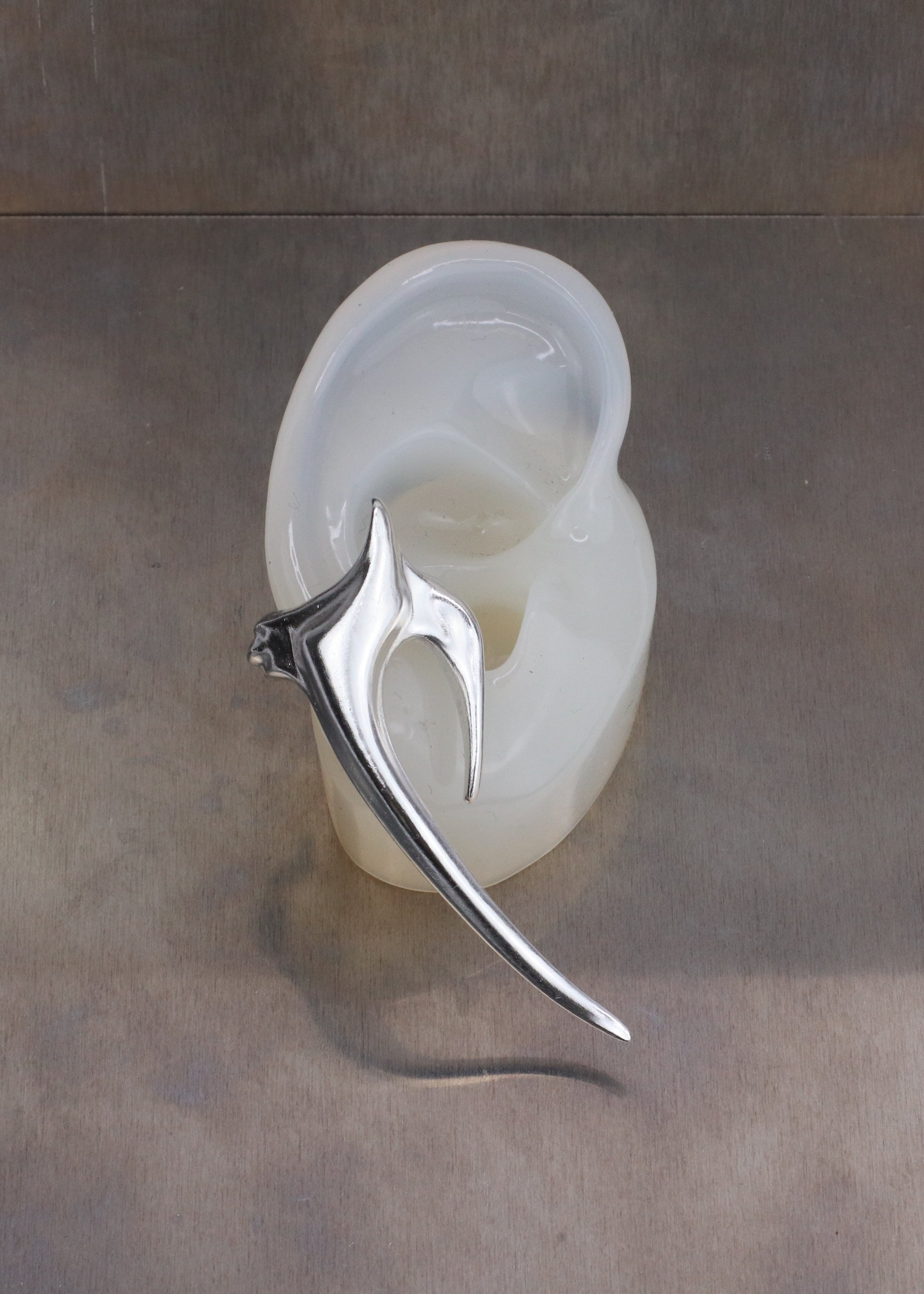 Sacral earcuff