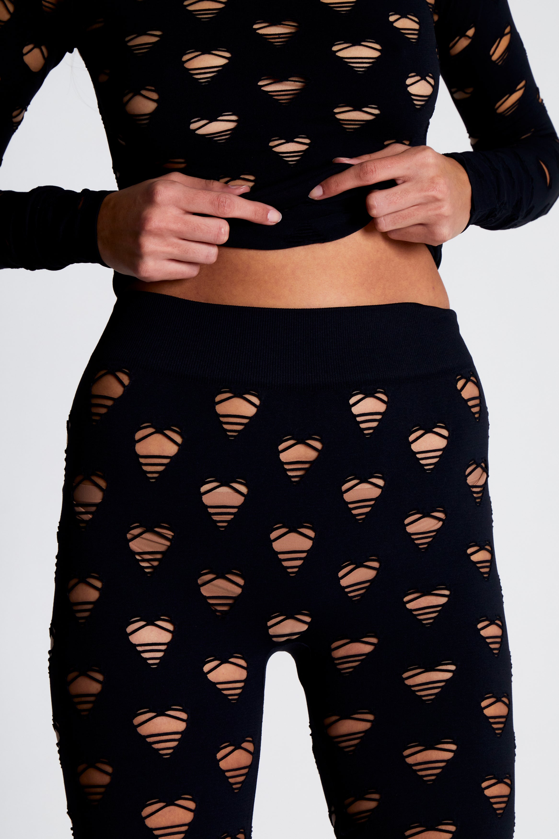 Perforated heart leggings