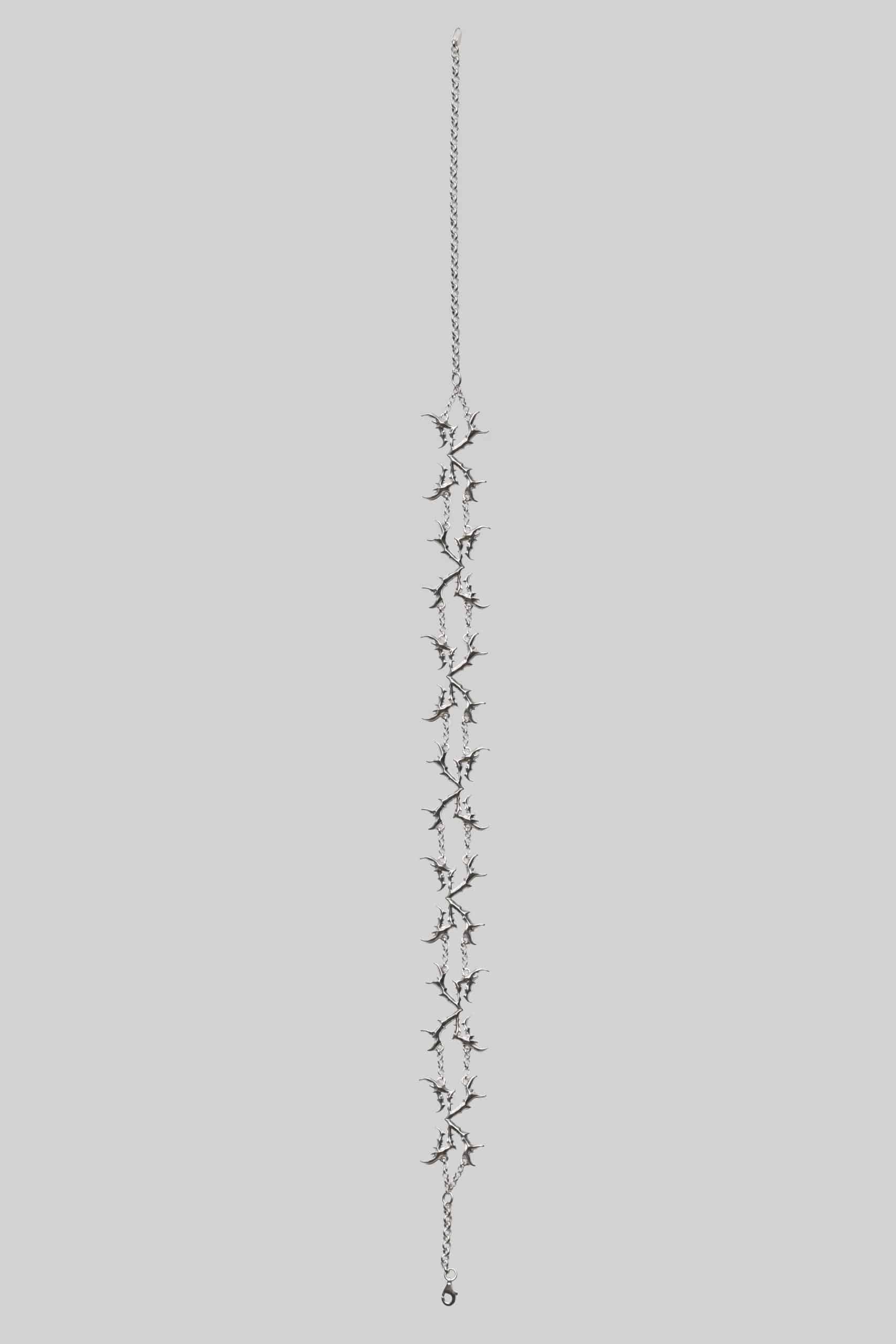 Symbolic bow necklace