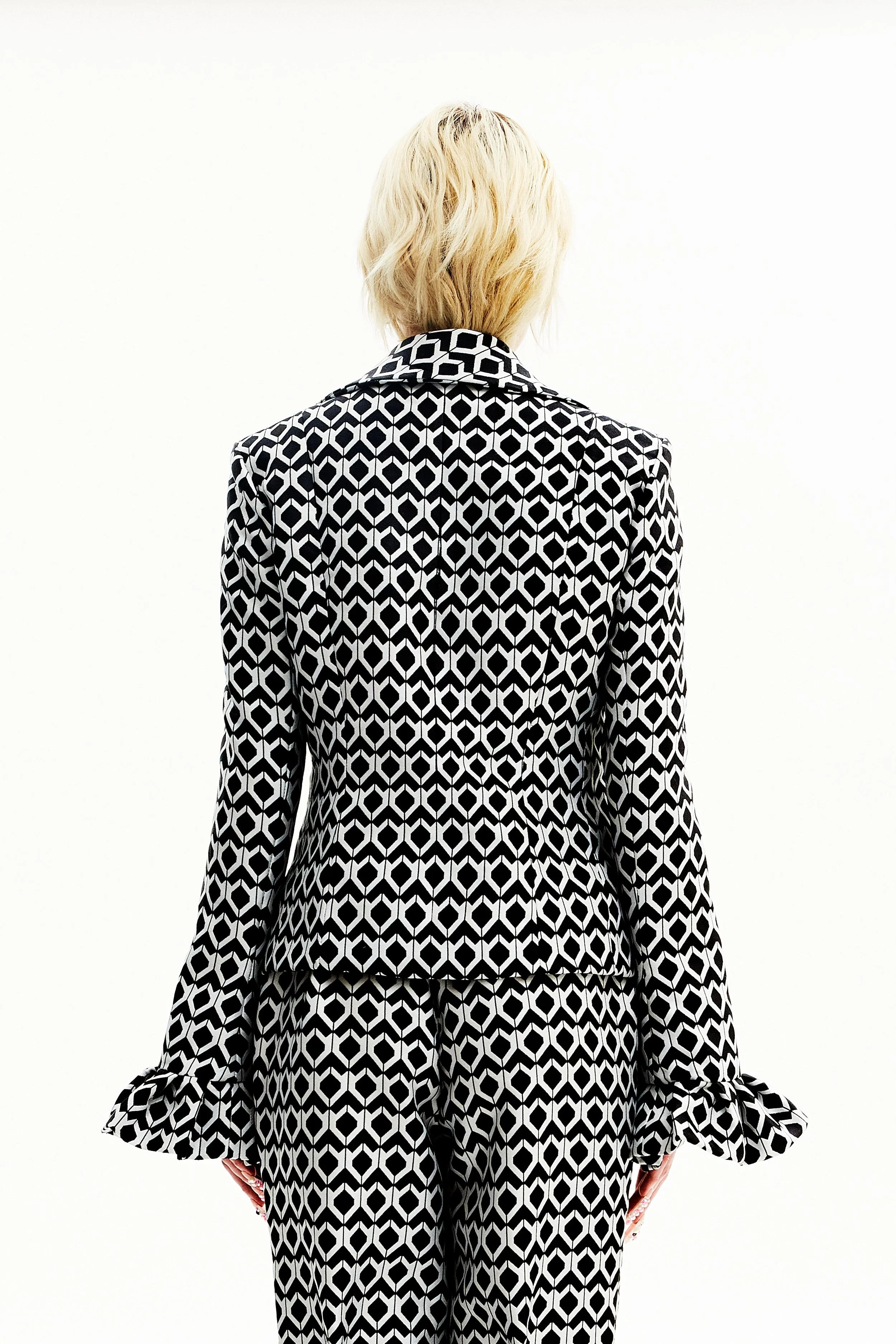 Veste noire et blanche géométrique