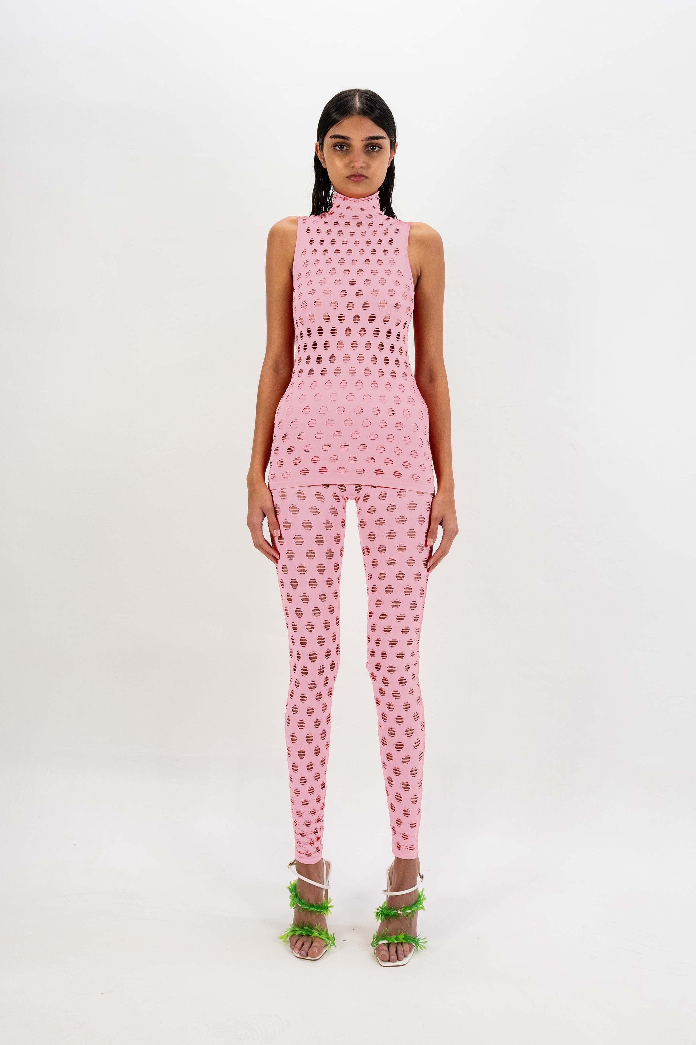 Perforated sleeveless turtleneck