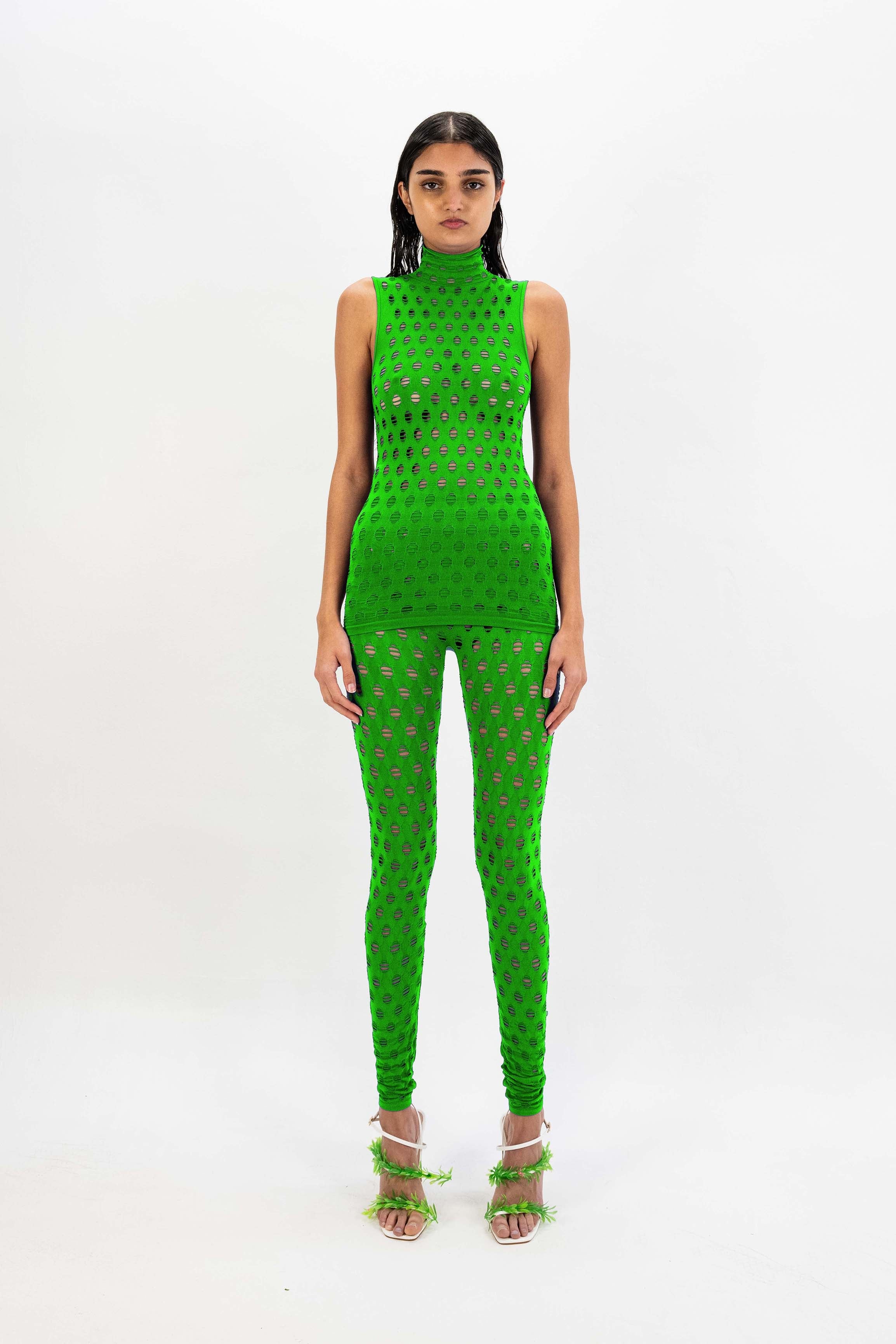 Perforated sleeveless turtleneck