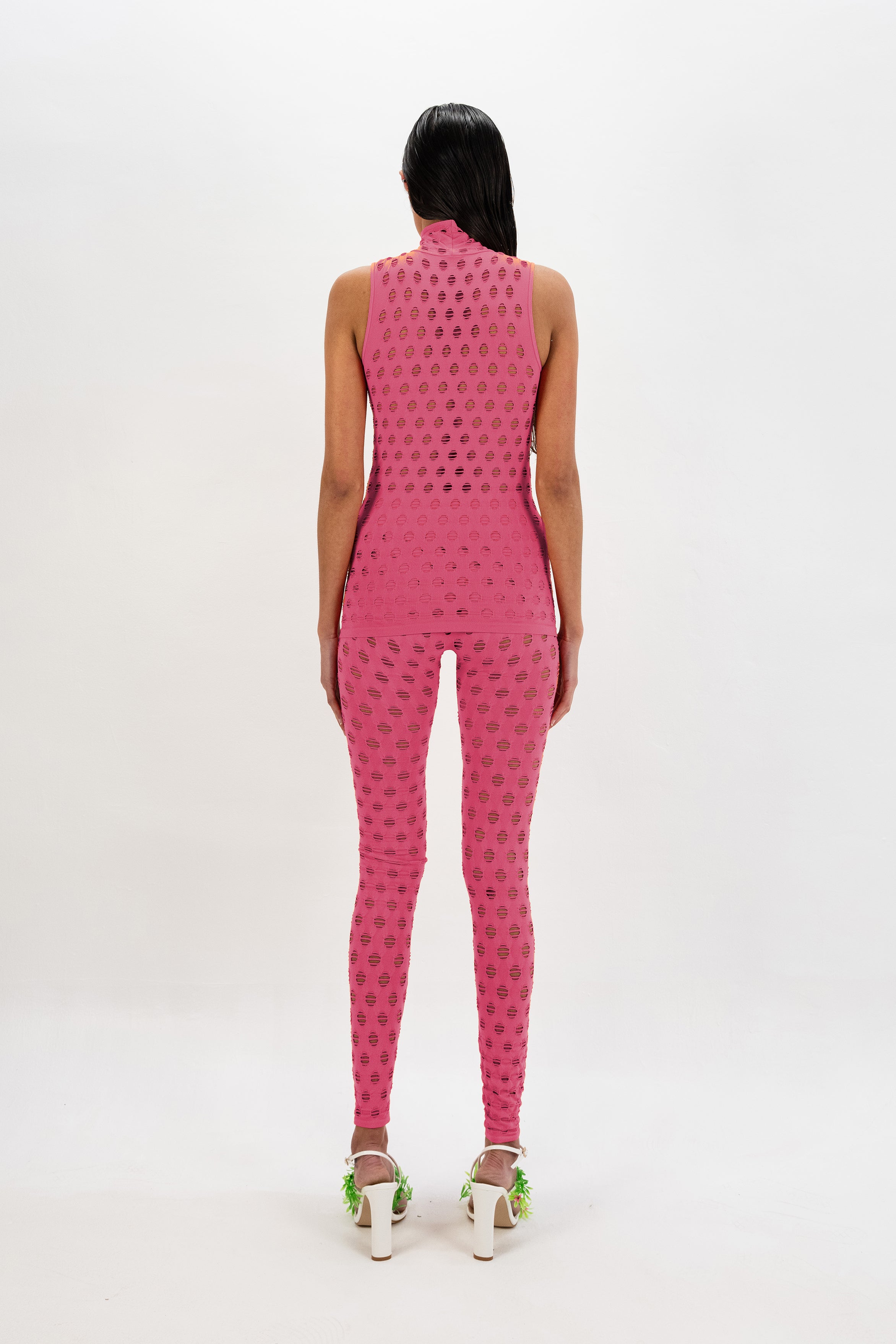 Perforated sleeveless turtleneck