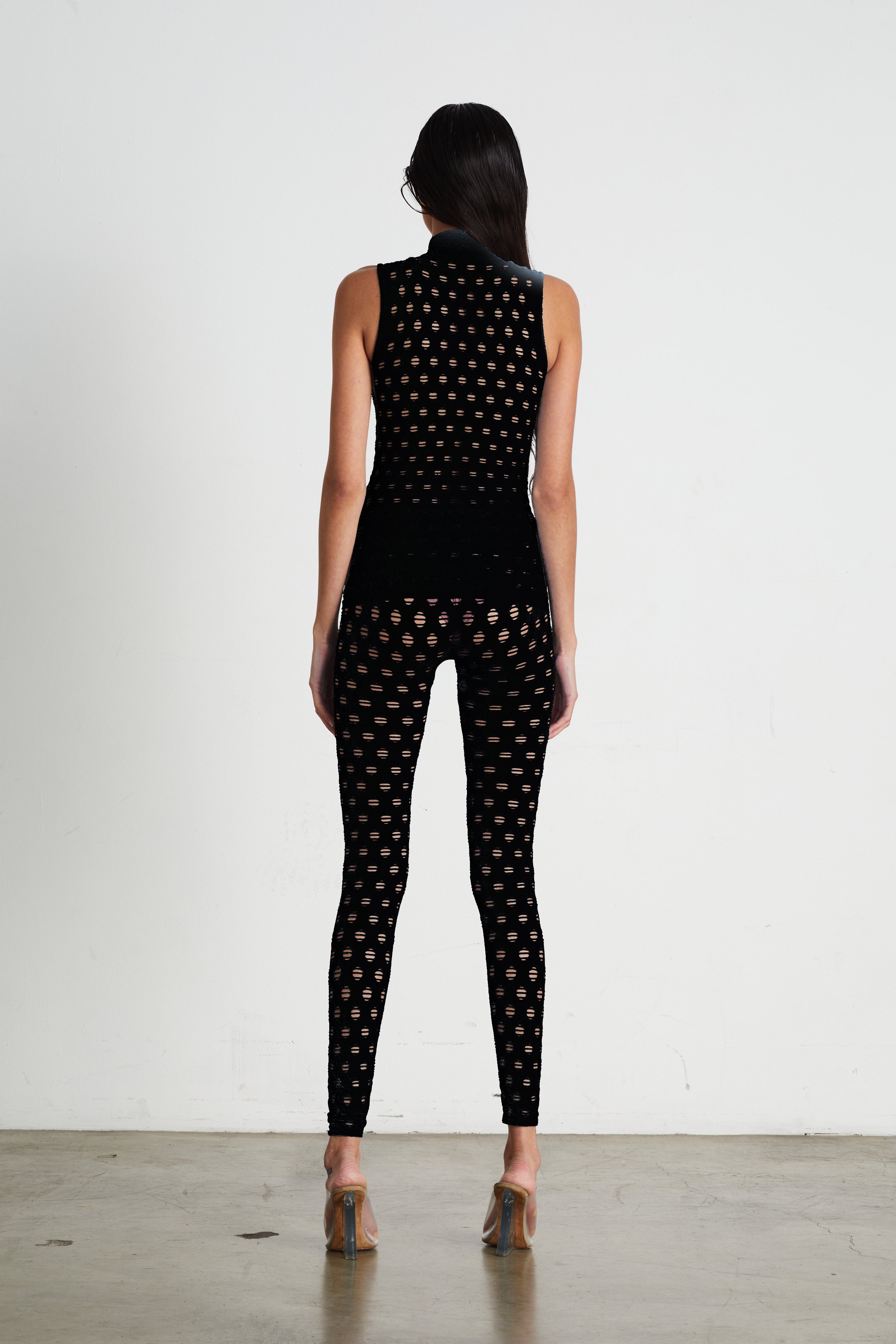 Perforated sleeveless turtleneck