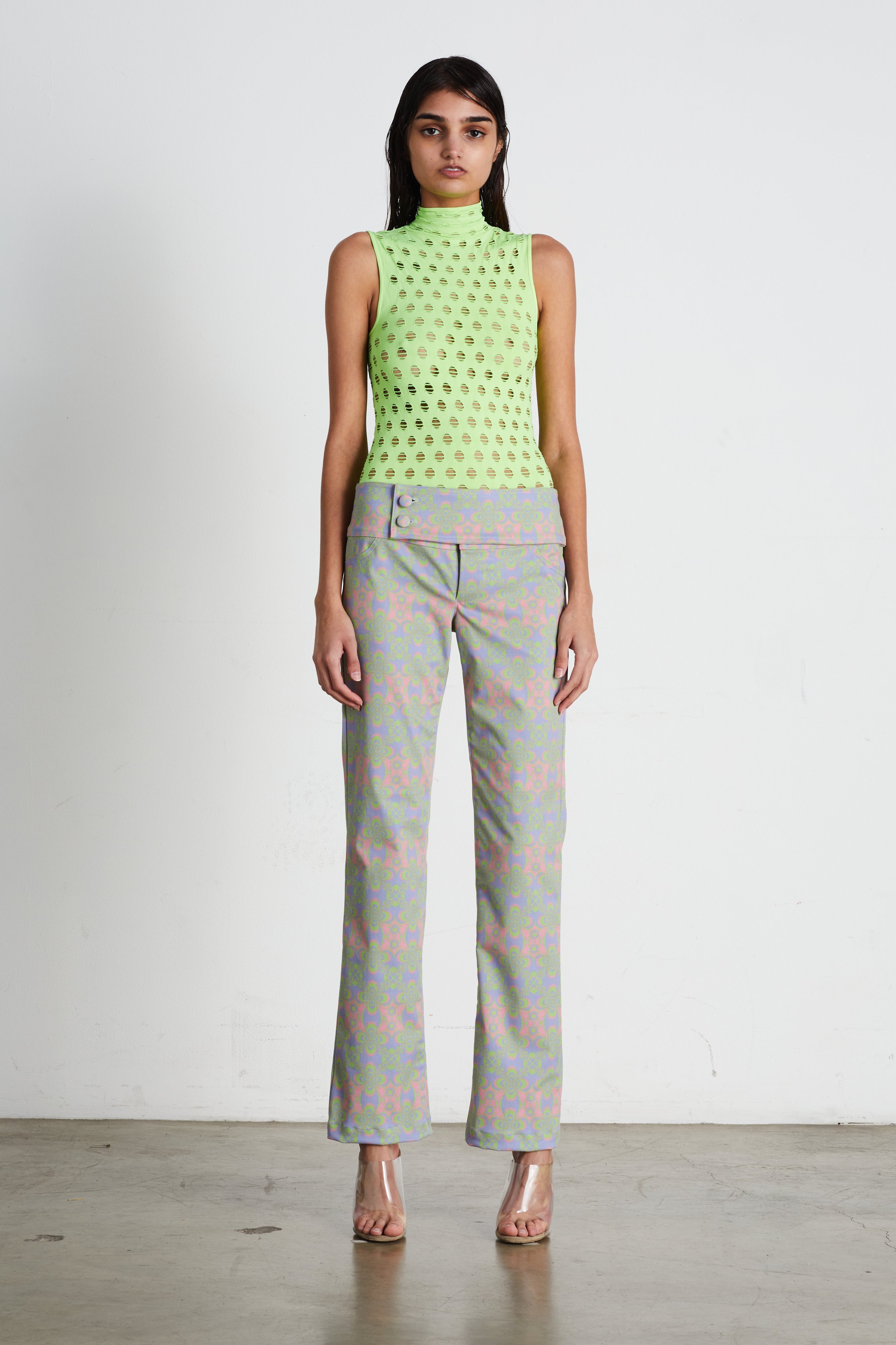 Perforated sleeveless turtleneck