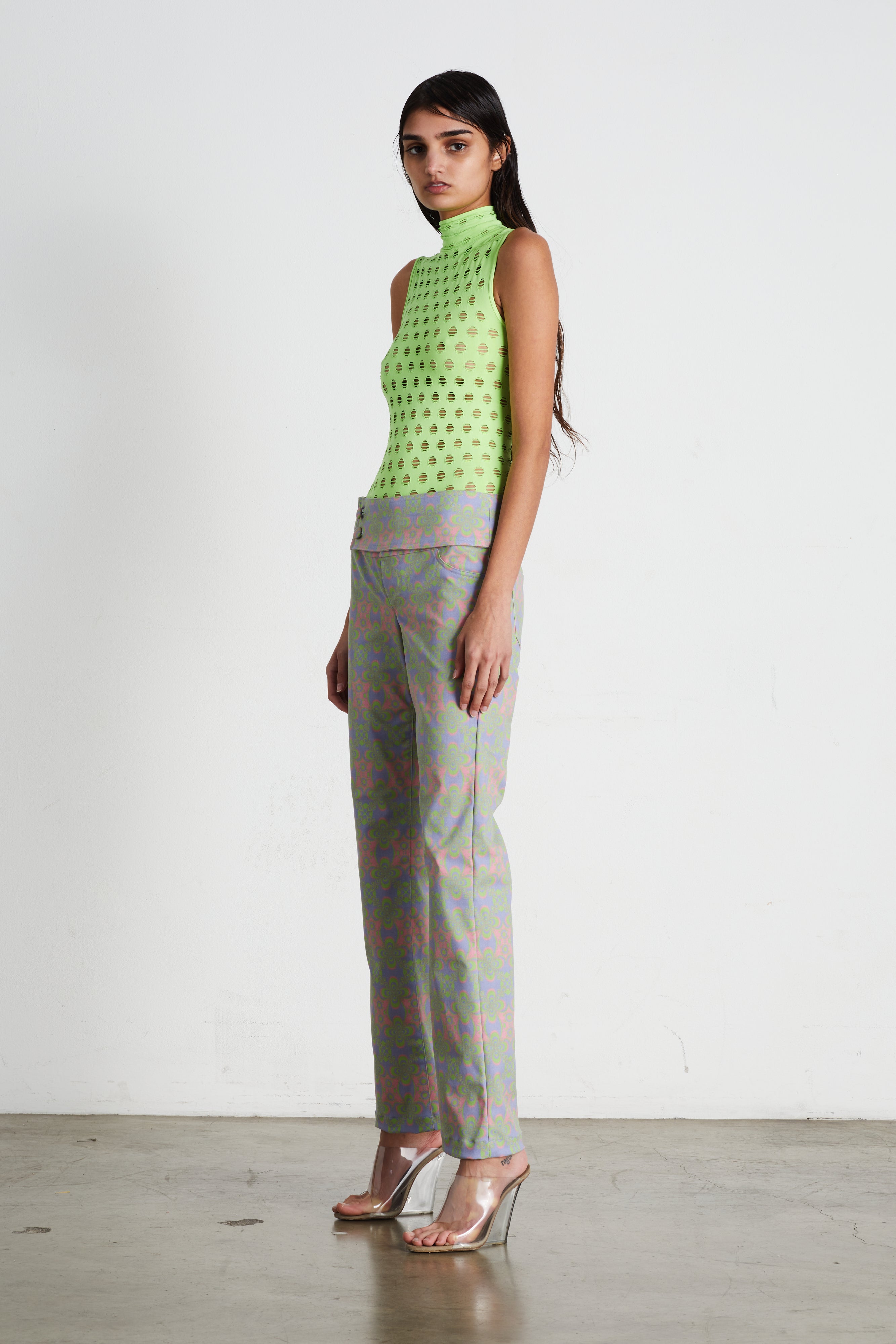 Perforated sleeveless turtleneck