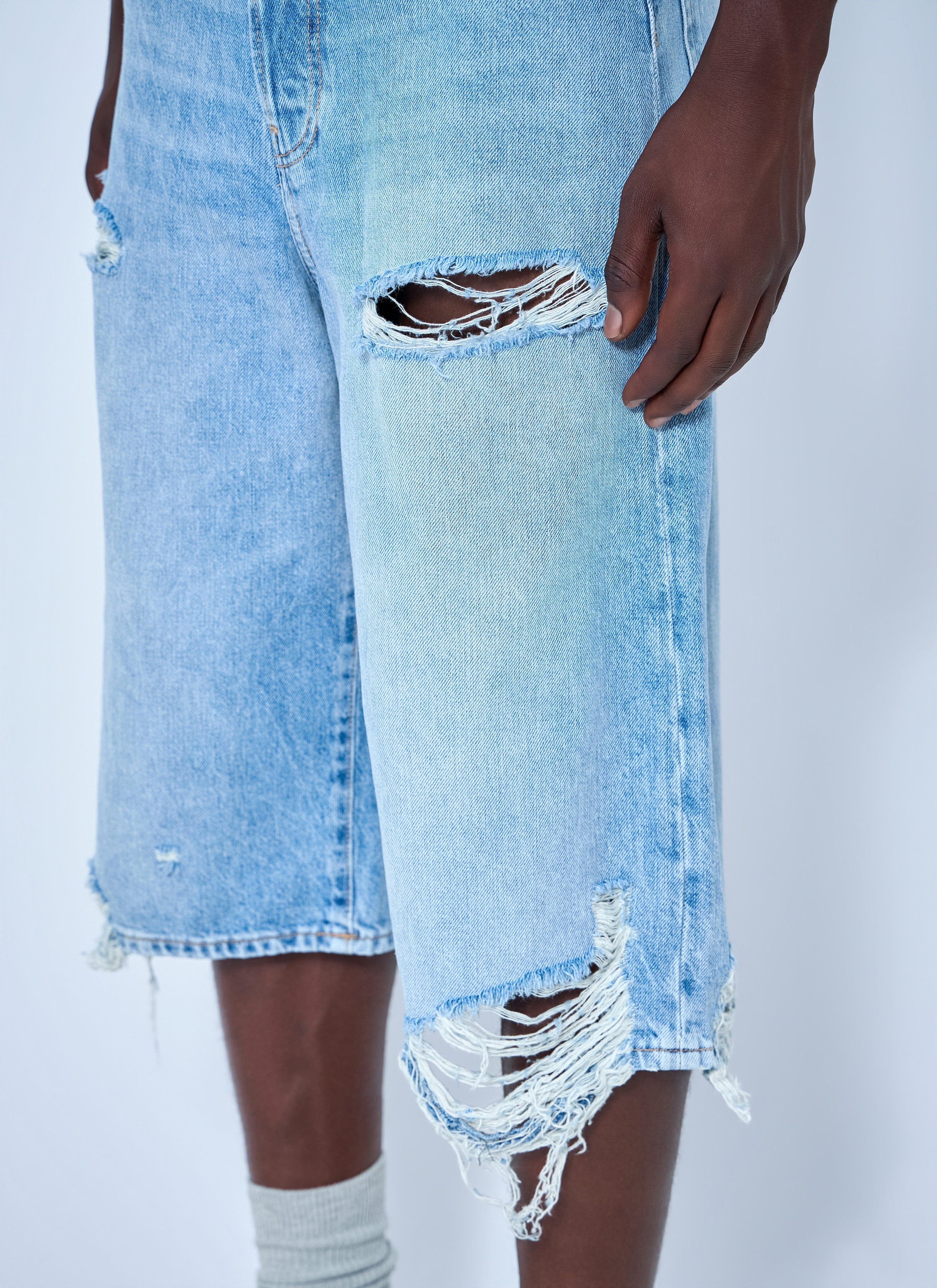 Distressed denim shorts