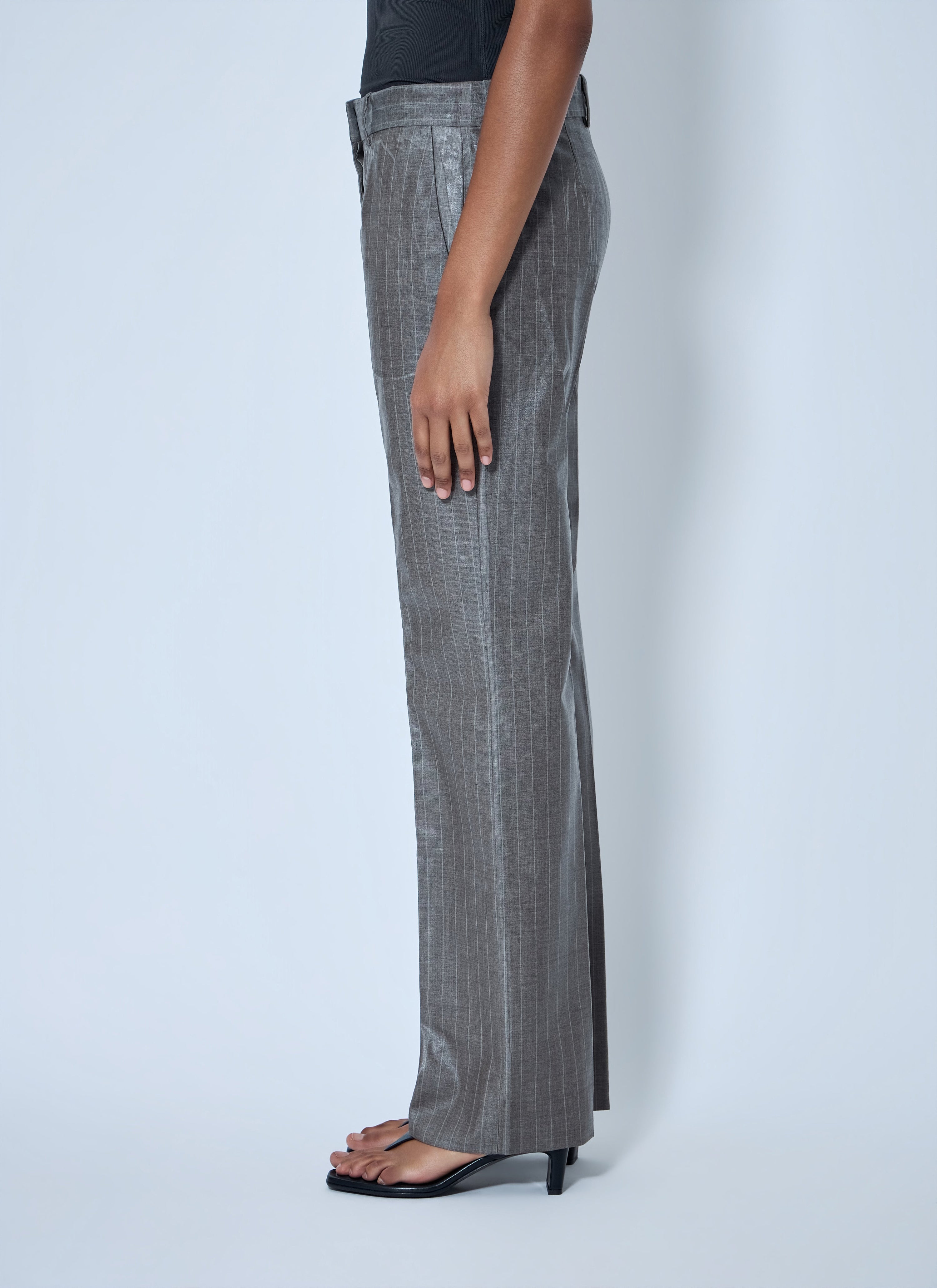 Coated pinstripe trousers
