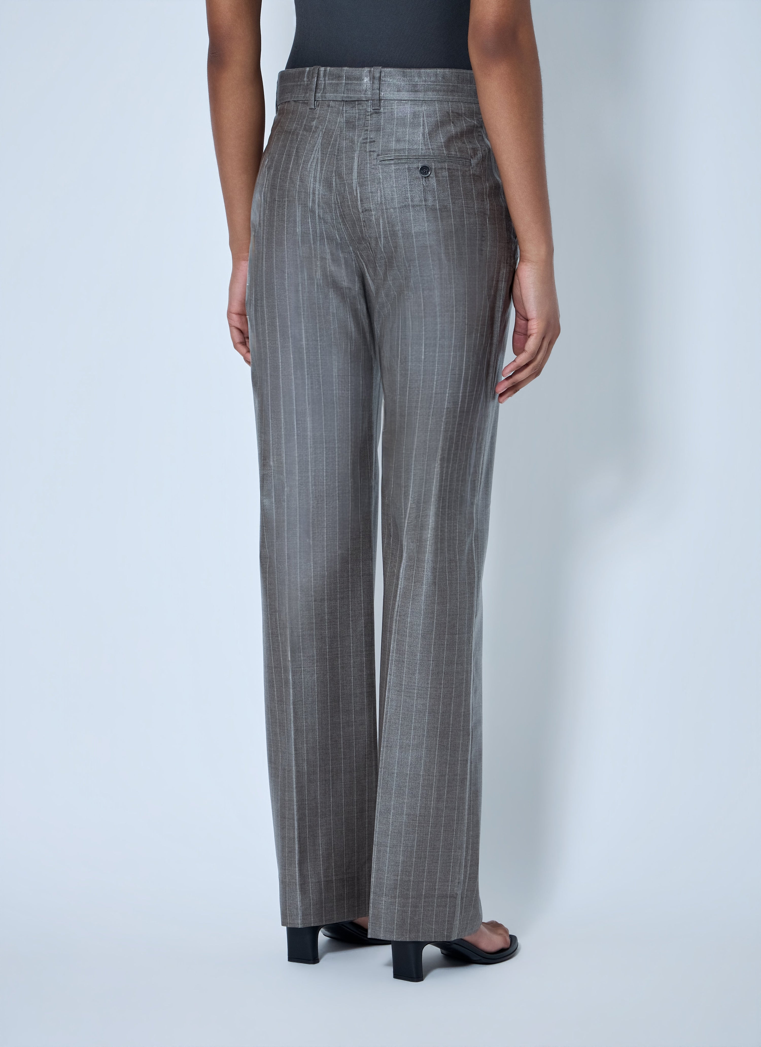 Coated pinstripe trousers