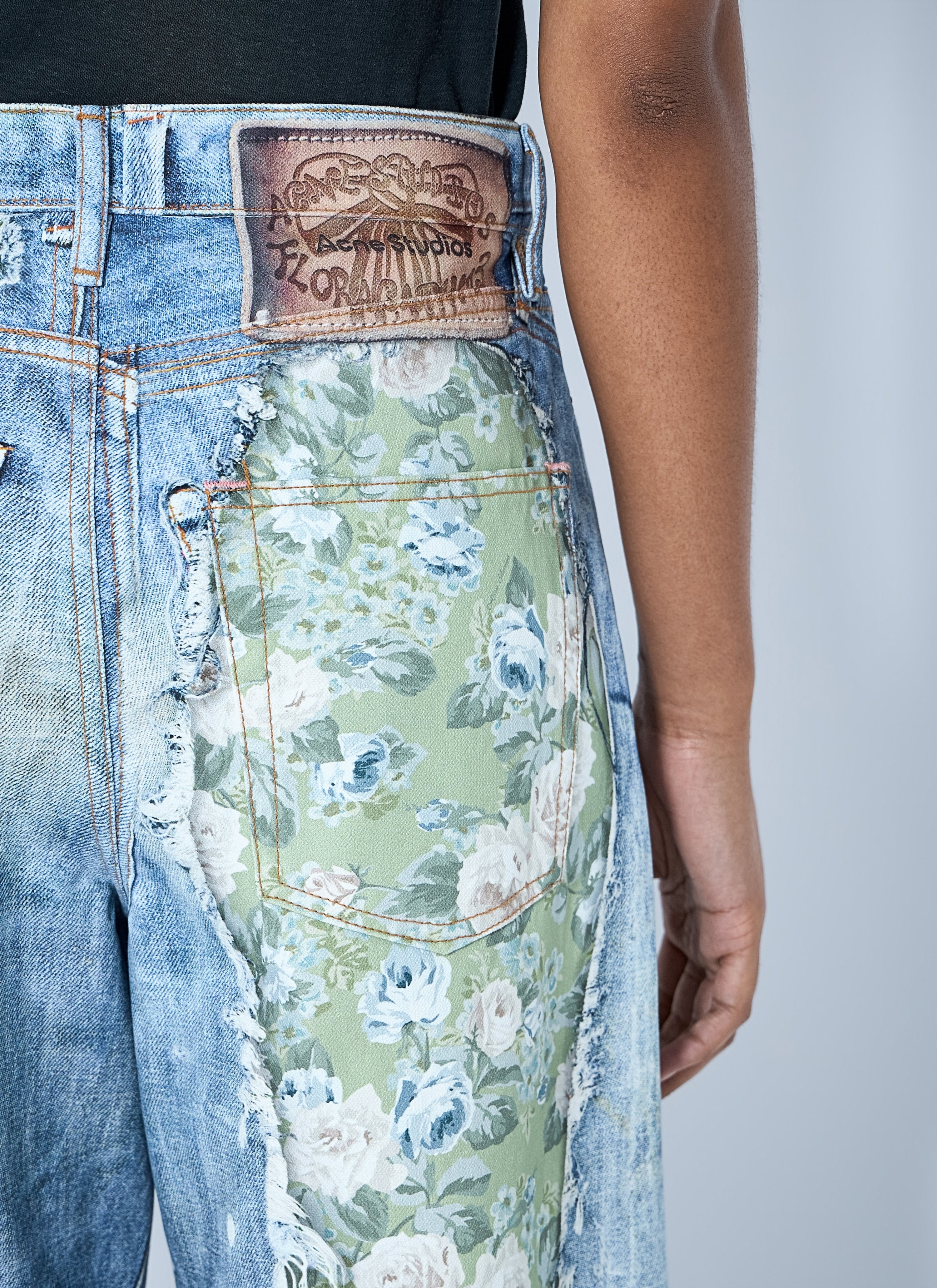Distressed floral patchwork jeans