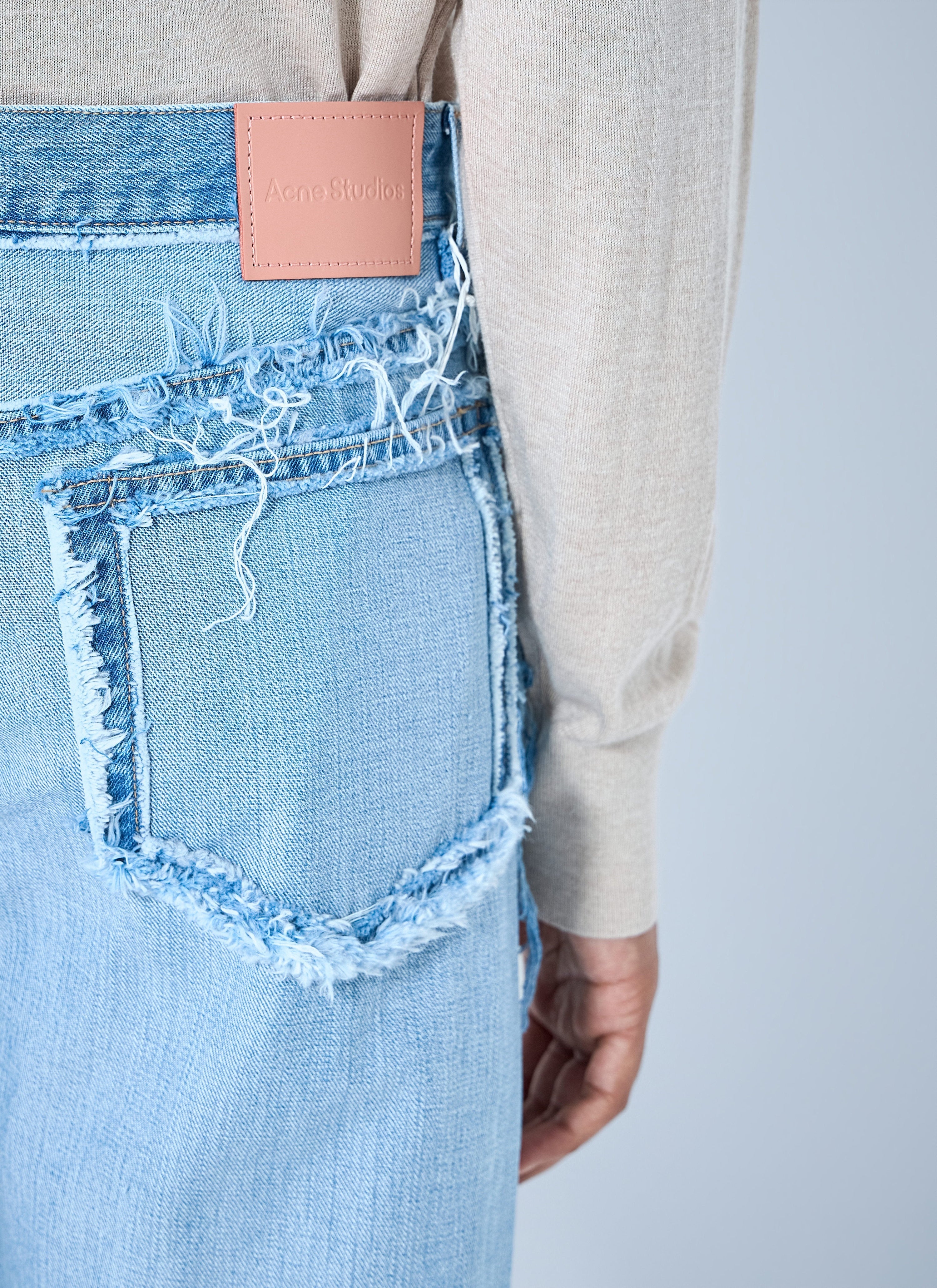 Frayed denim jeans