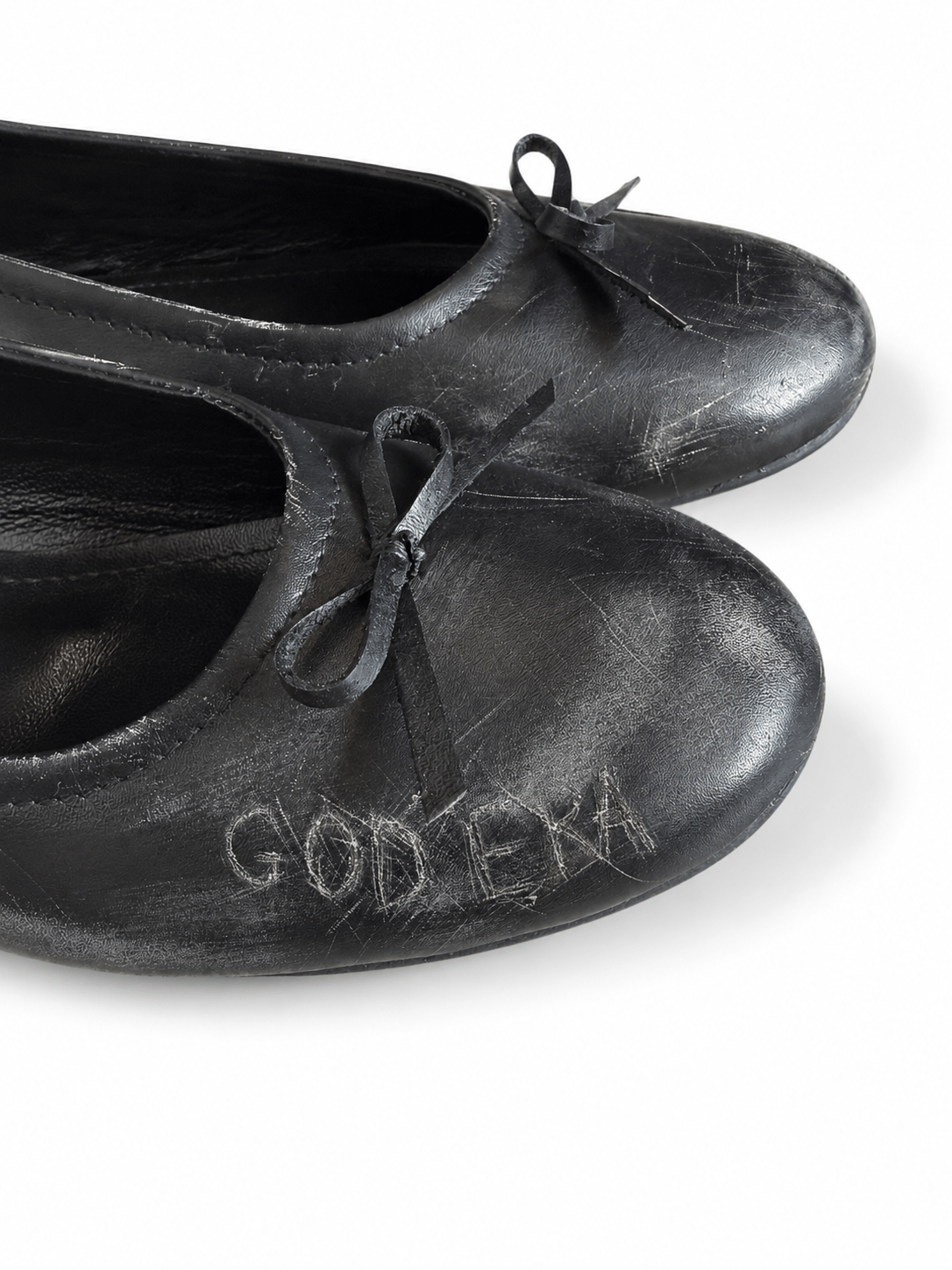 Scratched ballet flats
