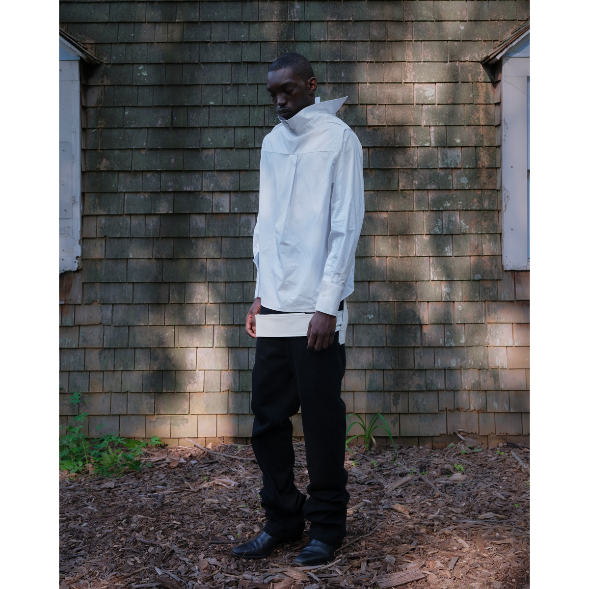 Belted leather-panel jeans