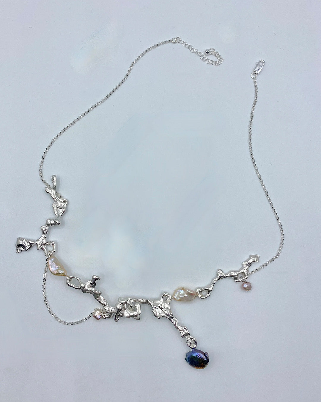 Fluid erosion necklace