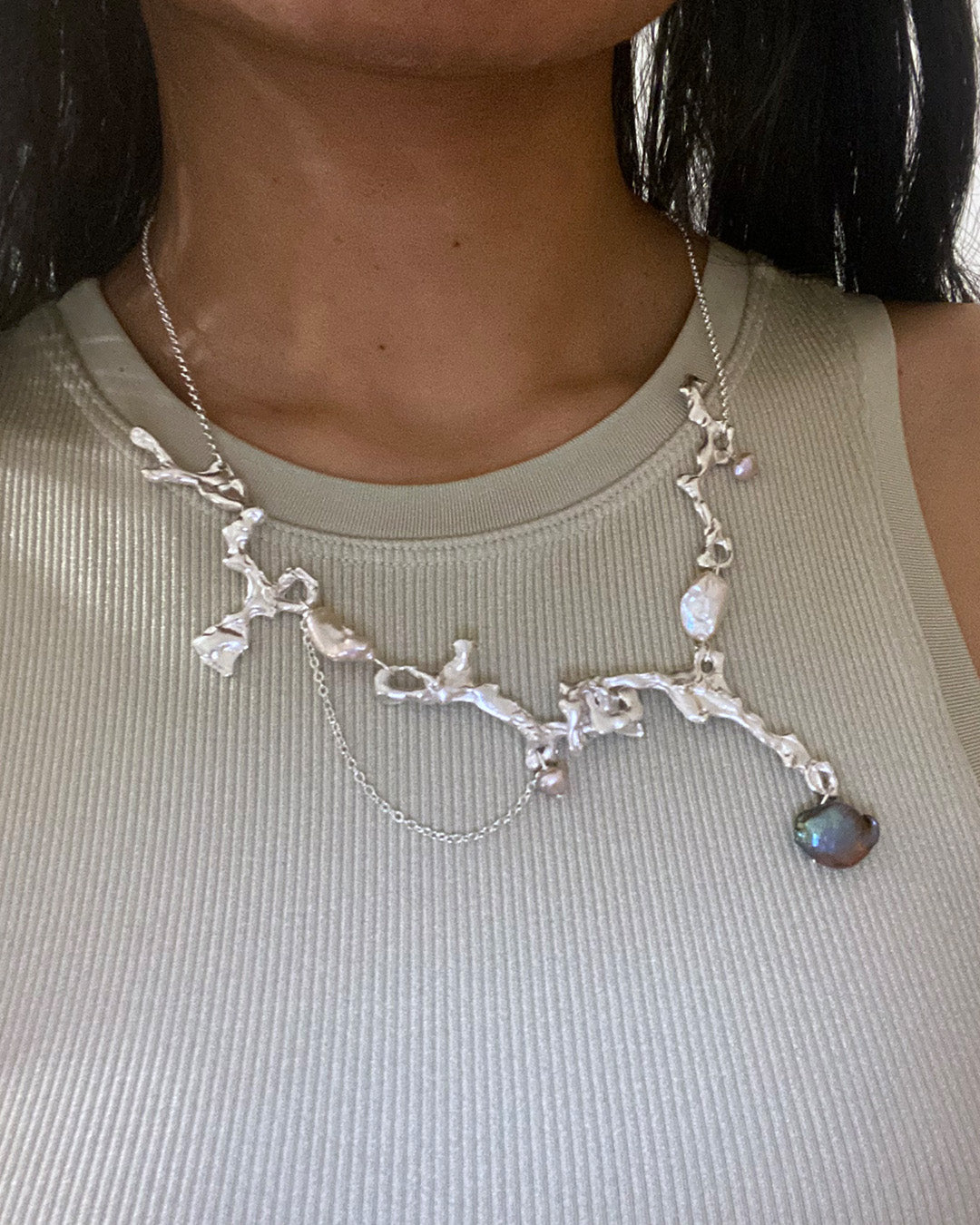 Fluid erosion necklace