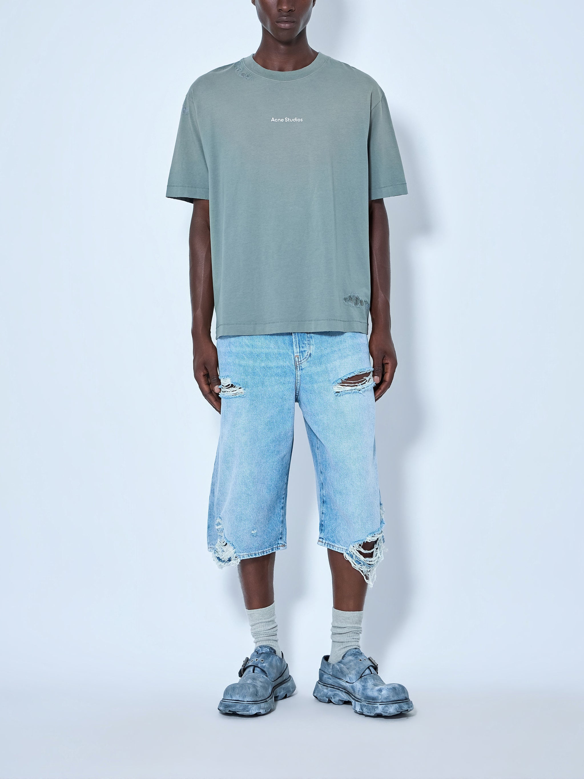 Distressed denim shorts