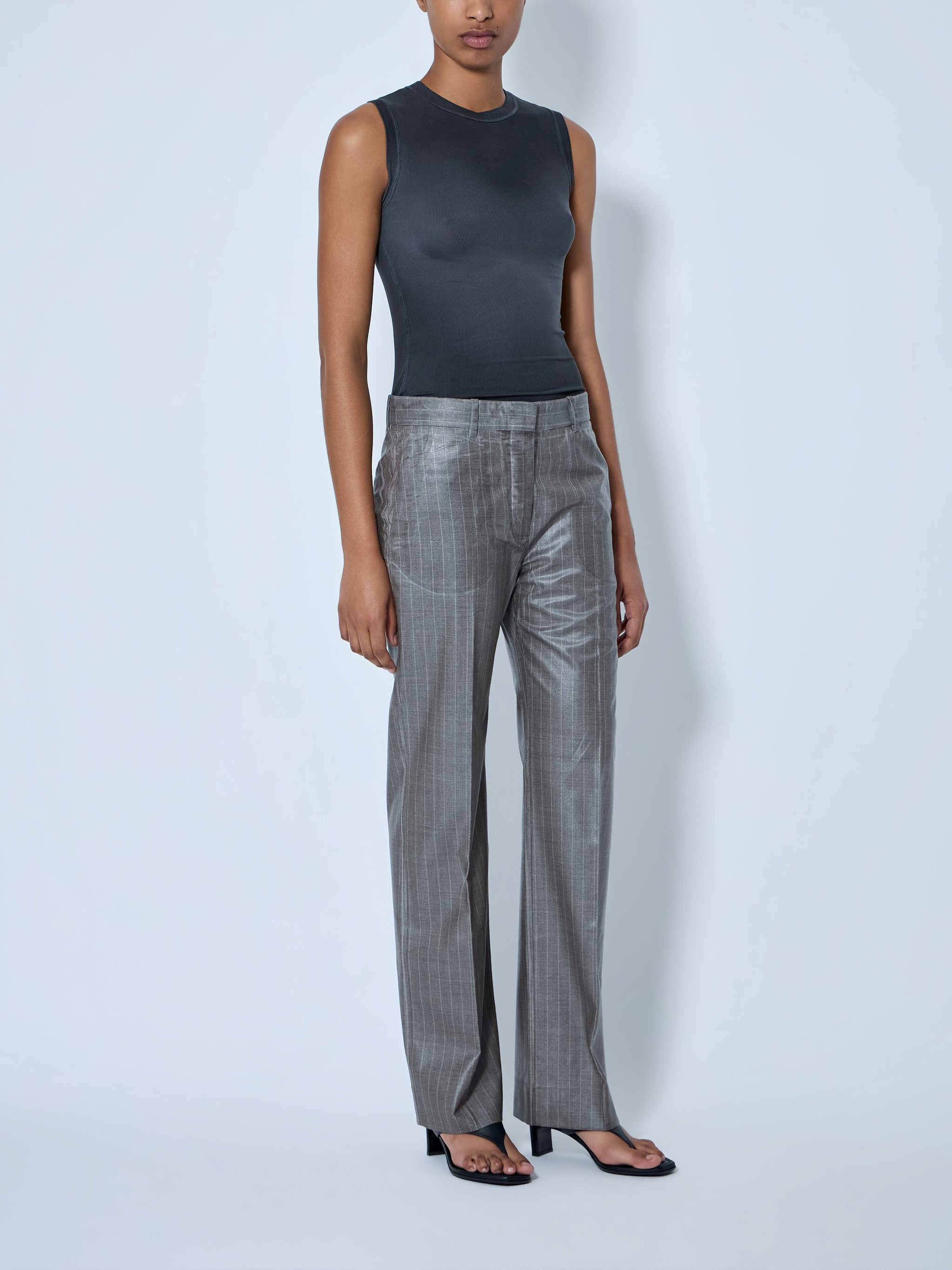 Coated pinstripe trousers