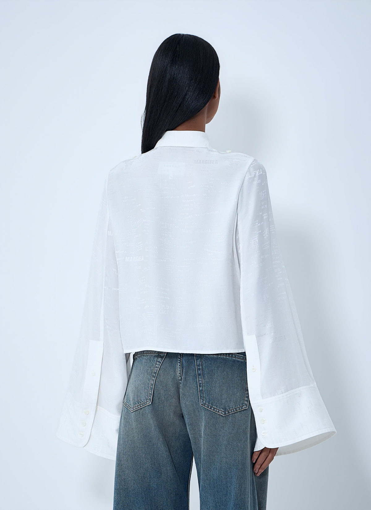 Button-down shirt with long flared sleeves