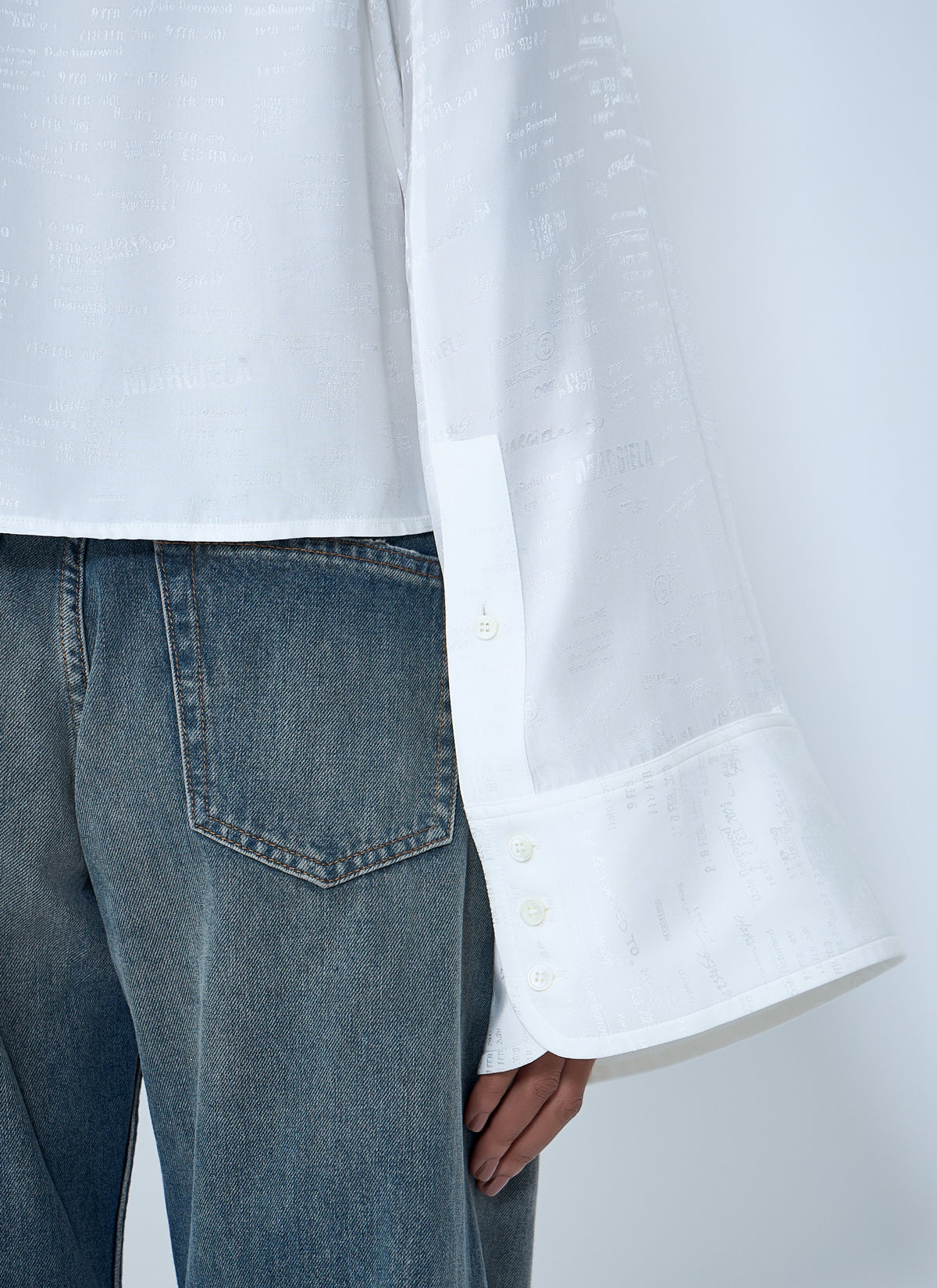 Button-down shirt with long flared sleeves