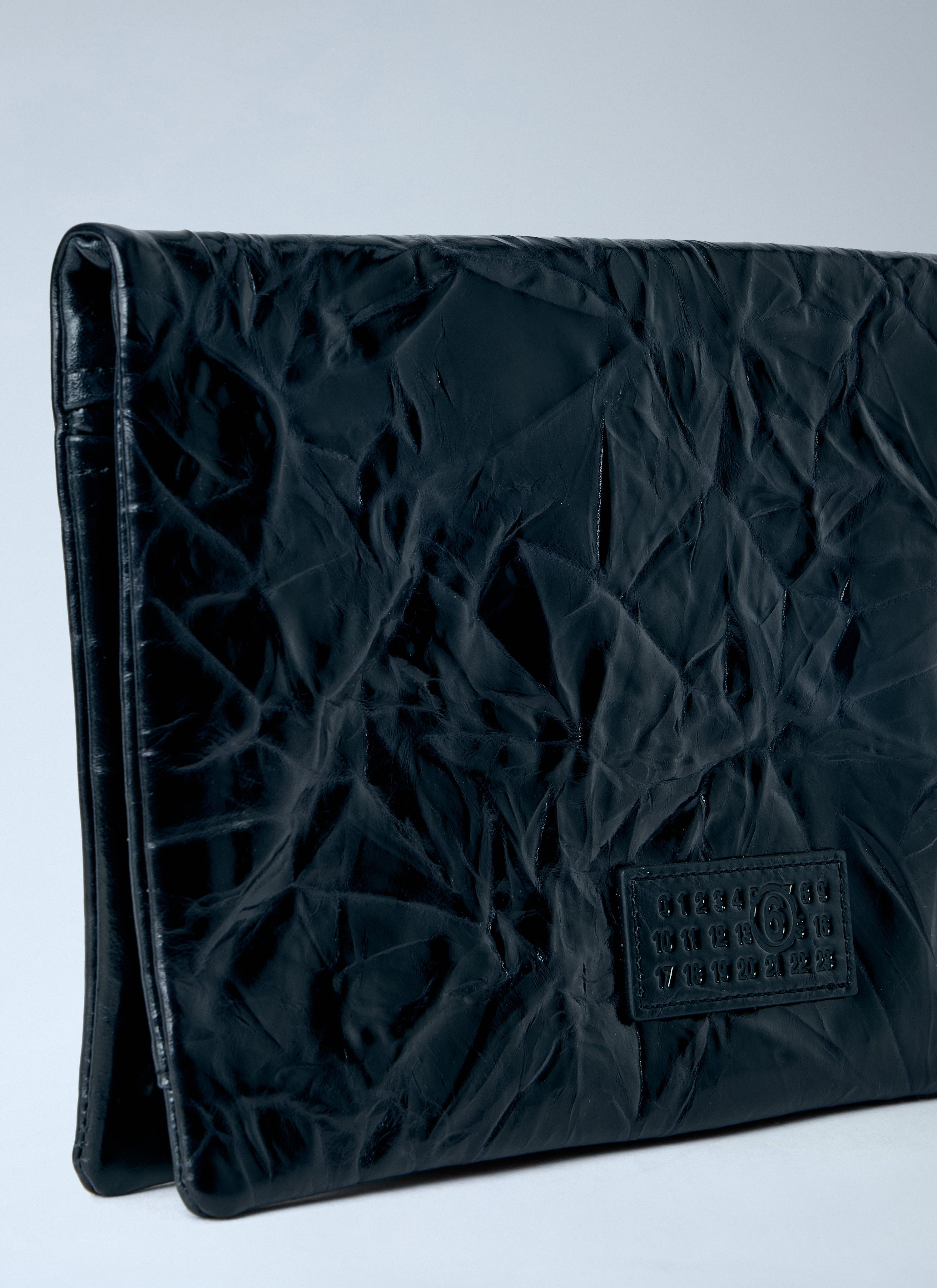 Single-stitch logo clutch bag