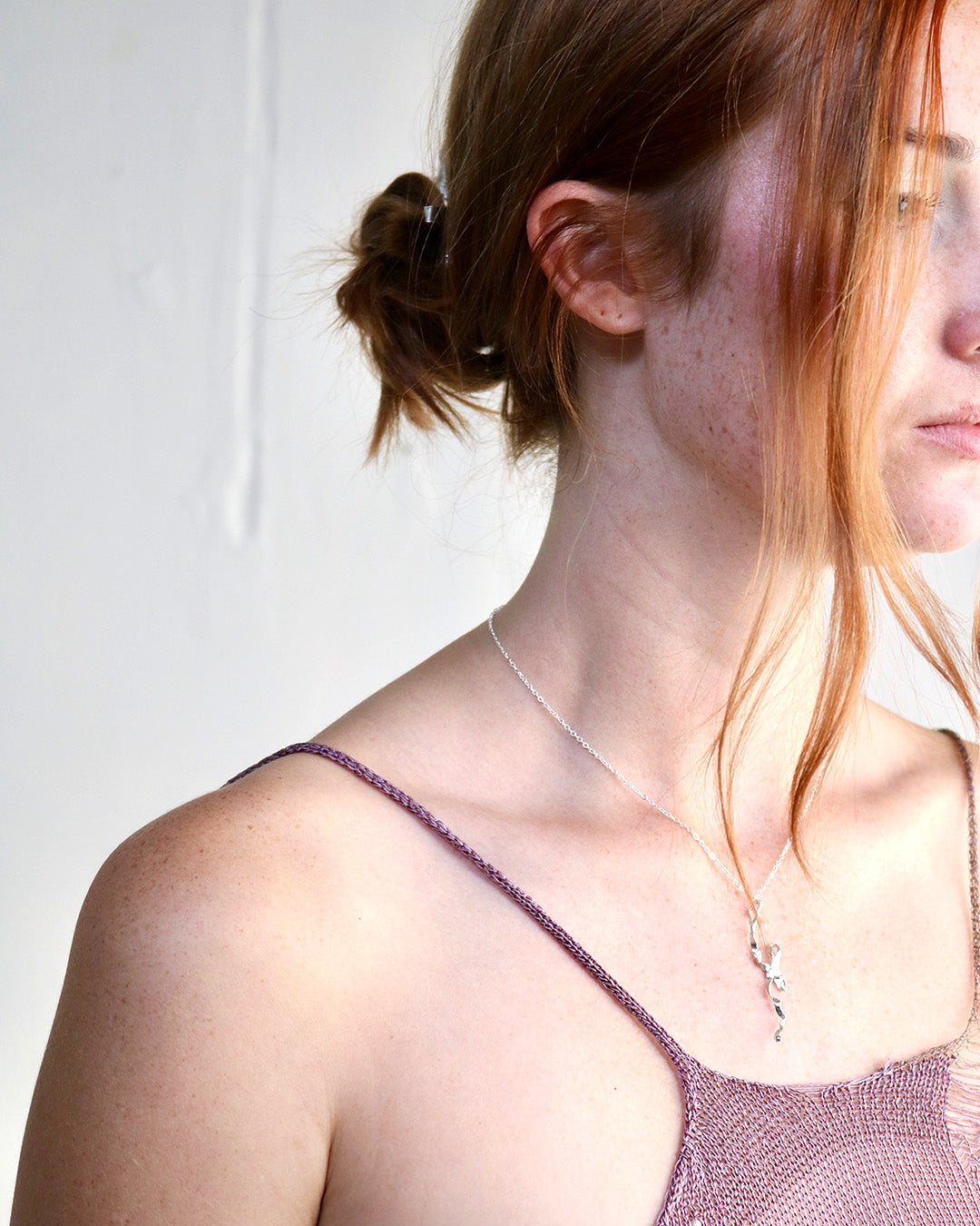 Burnt bow pendant - silver